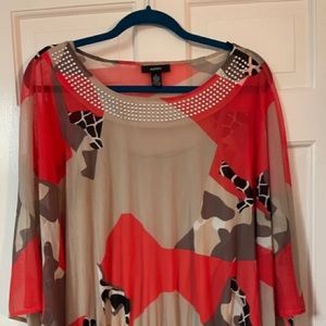 Fun, orange printed sheer top with matching tank top.